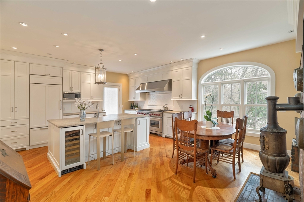 285 Clinton Road Brookline, MA 02245 - Photo 4 of 28 a large kitchen with a table and chairs