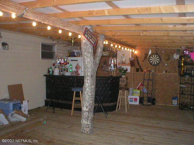 85979 Wilson Neck Road Yulee, FL 32097 - Photo 3 of 6 porch area with bar