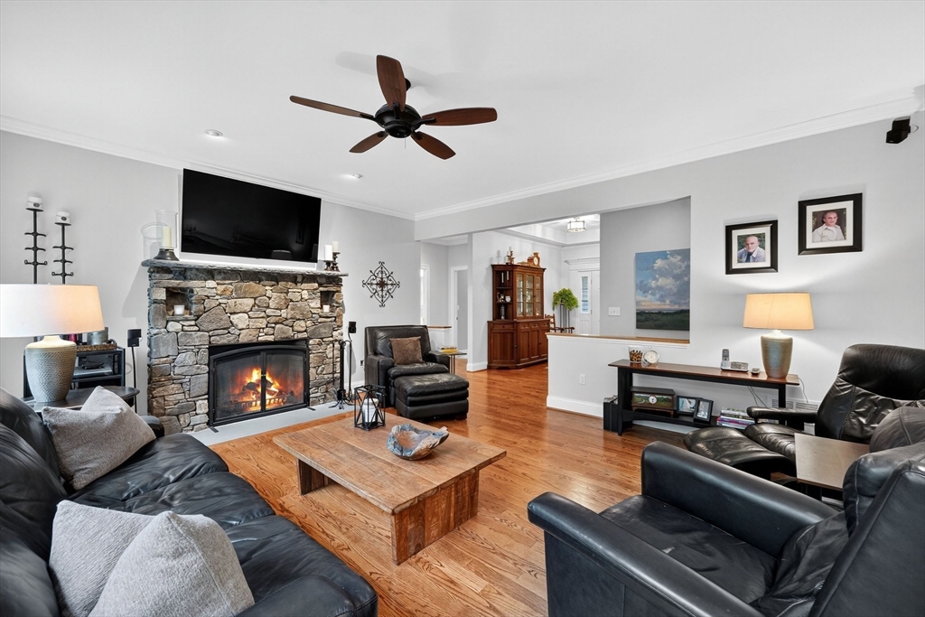176 Silver Street Granville, MA 01034 - Photo 15 of 40 a living room with furniture a flat screen tv and a fireplace