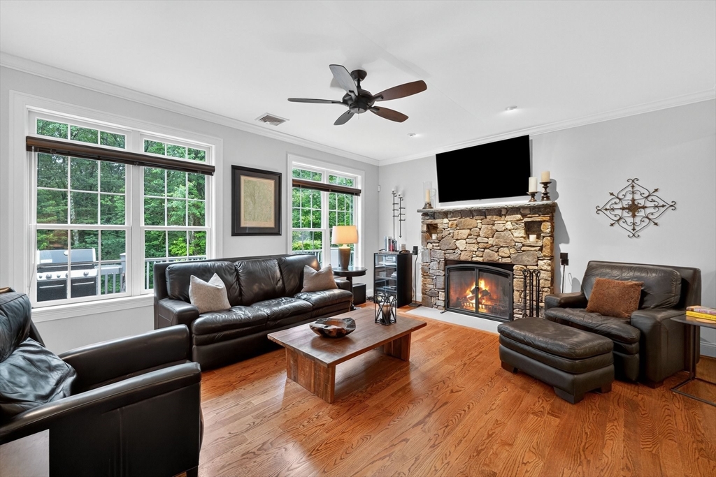 176 Silver Street Granville, MA 01034 - Photo 17 of 40 a living room with furniture a fireplace and a flat screen tv
