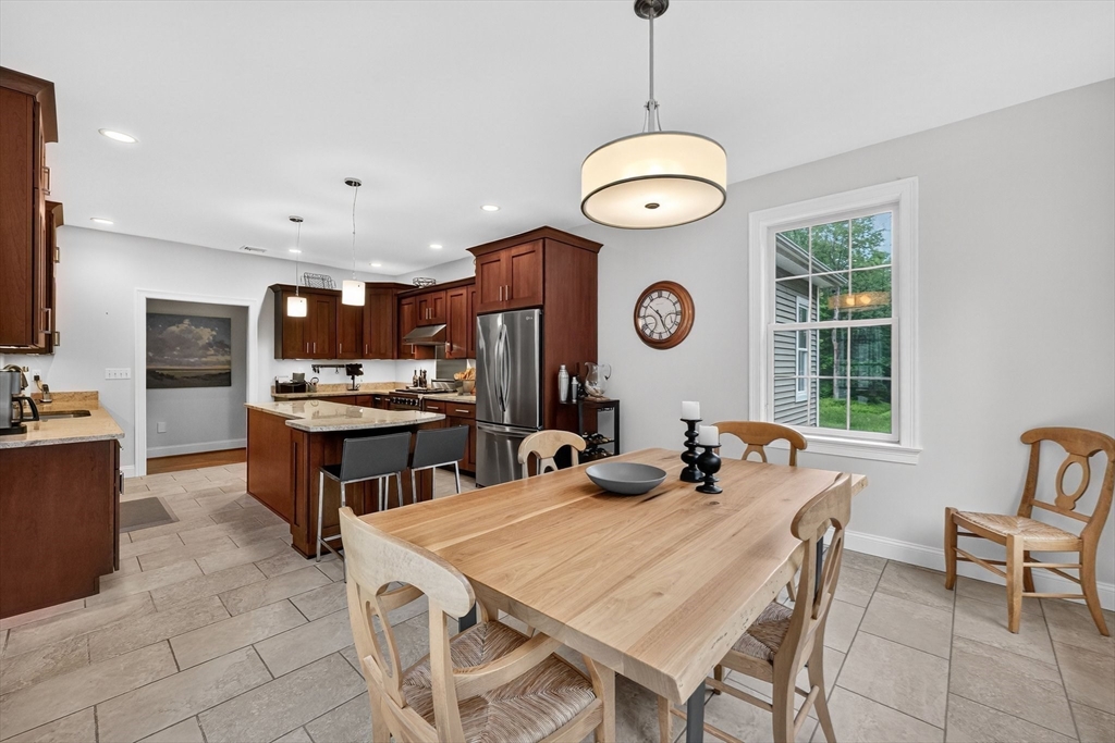 176 Silver Street Granville, MA 01034 - Photo 22 of 40 a large kitchen with a table and chairs