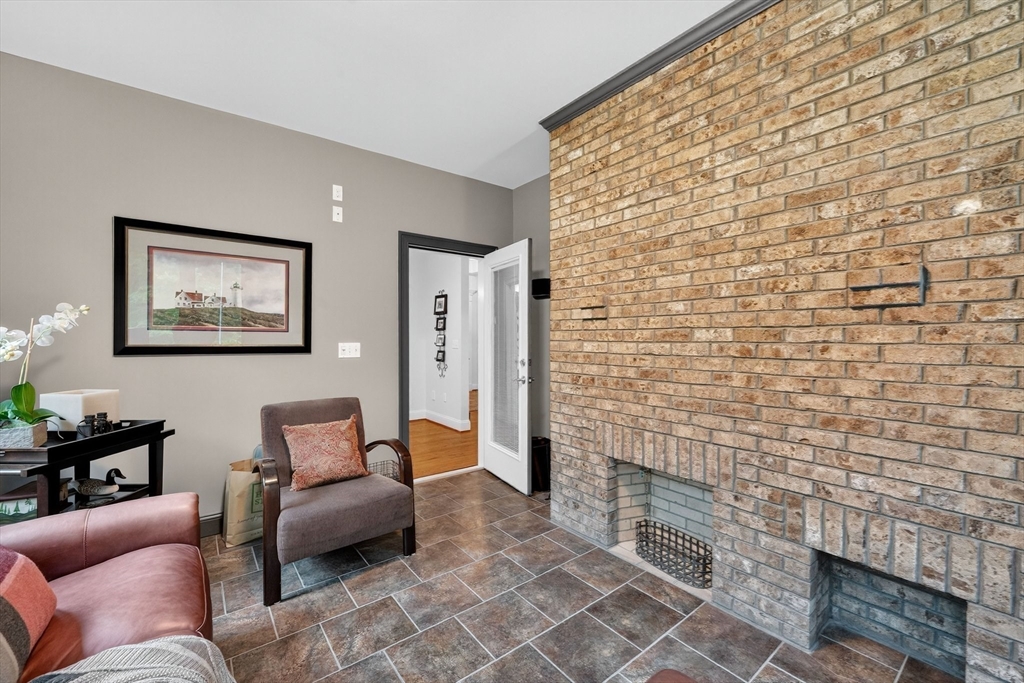 176 Silver Street Granville, MA 01034 - Photo 26 of 40 a living room with furniture and a fireplace