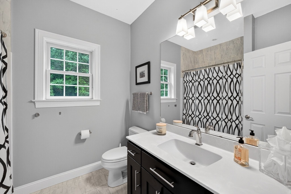 176 Silver Street Granville, MA 01034 - Photo 34 of 40 a bathroom with a sink a toilet and mirror