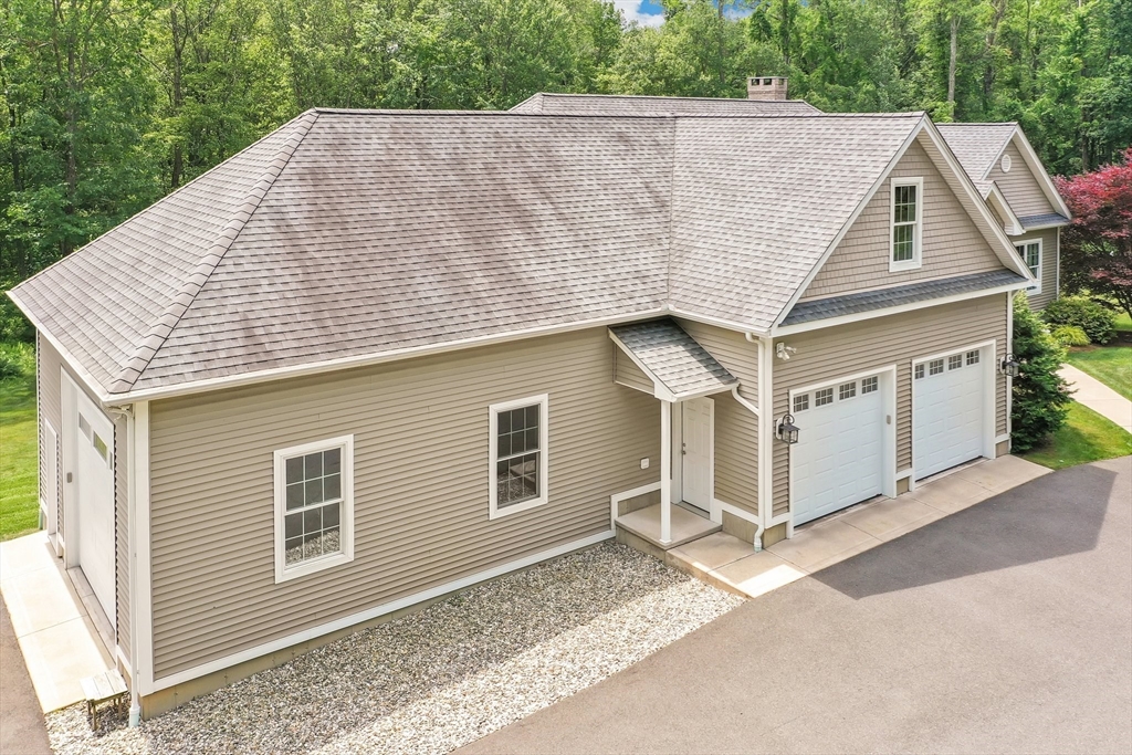 176 Silver Street Granville, MA 01034 - Photo 4 of 40 a view of a house with a backyard