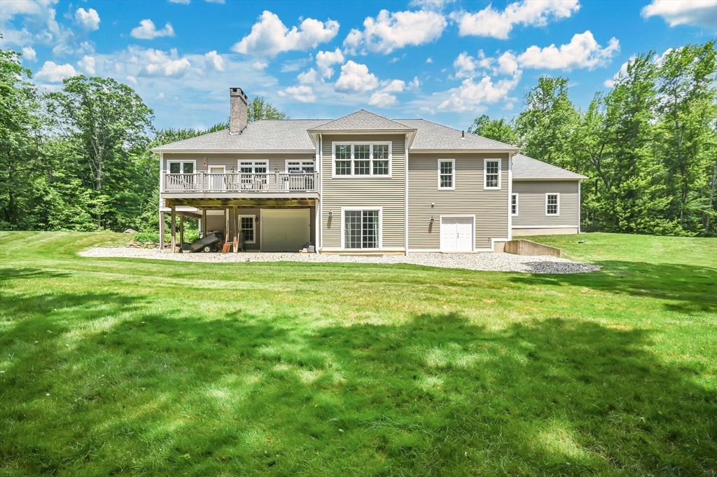 176 Silver Street Granville, MA 01034 - Photo 10 of 40 a front view of a house with a yard