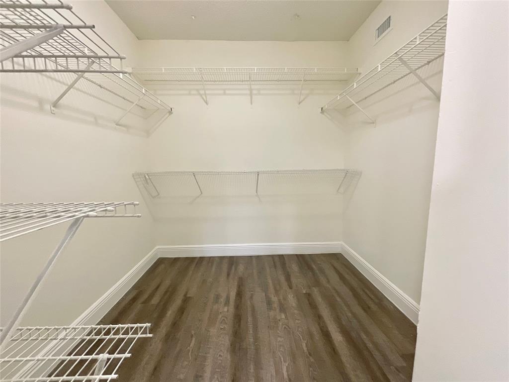 9357 Southwest 77th Avenue, Unit 25245 Miami, FL 33156 - Photo 5 of 20 a view of a room with racks on the wall