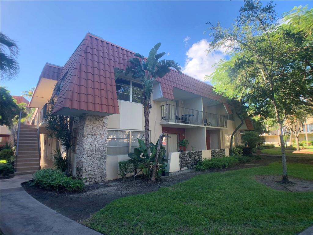 9357 Southwest 77th Avenue, Unit 25245 Miami, FL 33156 - Photo 8 of 20 a house view with a garden space