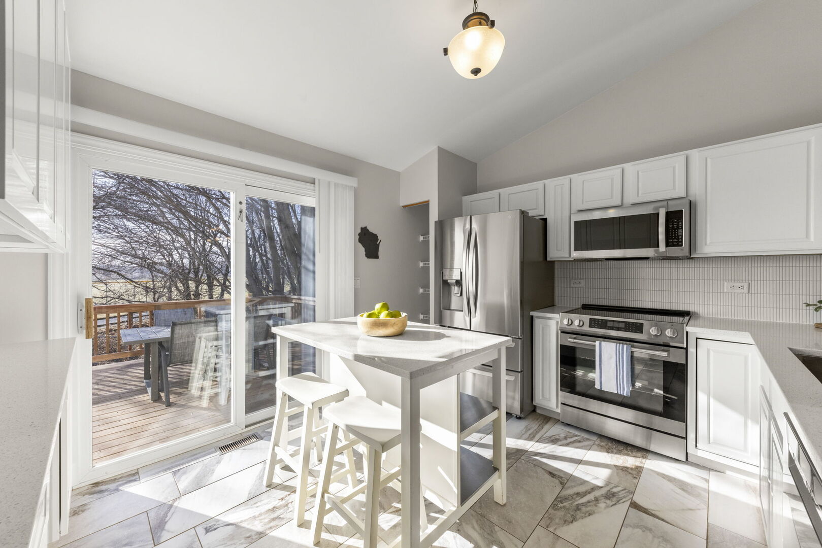 687 Springwood Drive Joliet, IL 60431 - Photo 9 of 32 a kitchen with stainless steel appliances a stove a sink refrigerator and a microwave