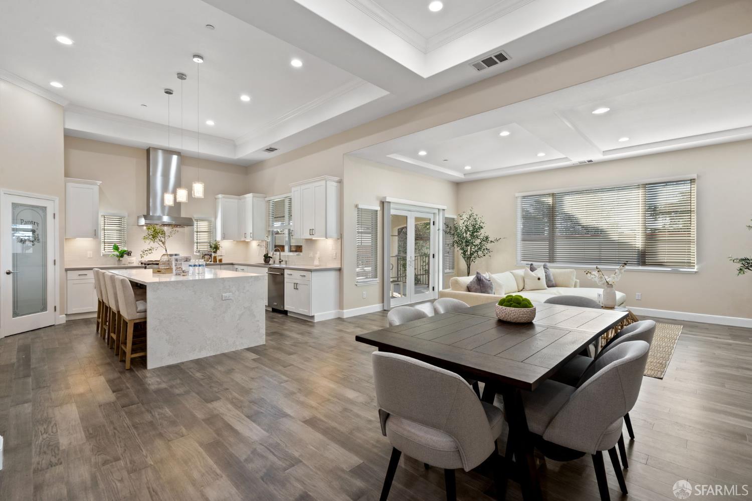 42119 Vinha Way Fremont, CA 94539 - Photo 15 of 43 a kitchen with a table chairs and wooden floor