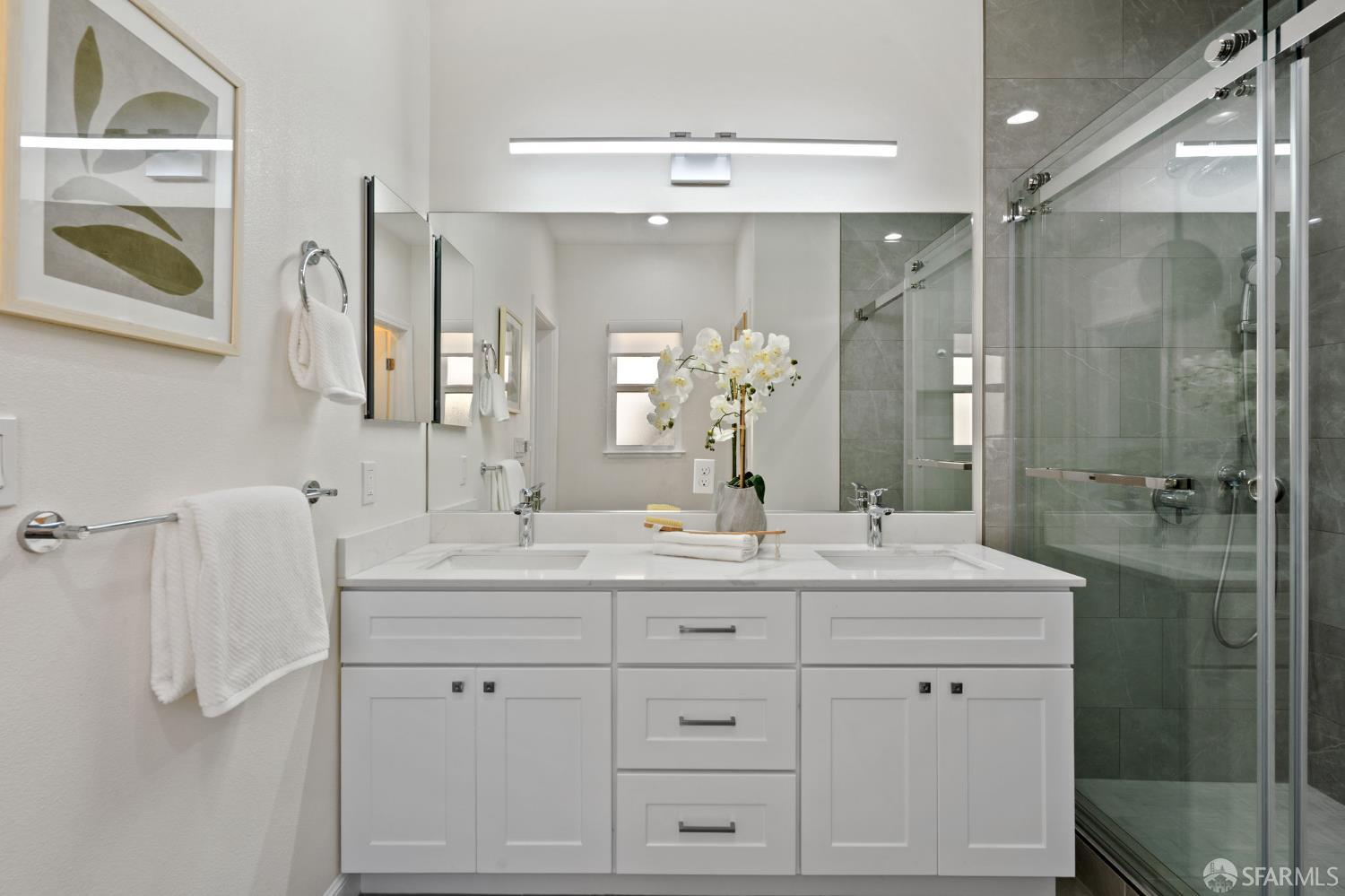 42119 Vinha Way Fremont, CA 94539 - Photo 18 of 43 a bathroom with a double vanity sink mirror and shower