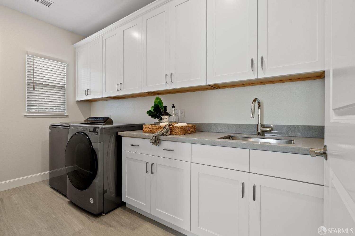 42119 Vinha Way Fremont, CA 94539 - Photo 23 of 43 a kitchen with a sink and cabinets