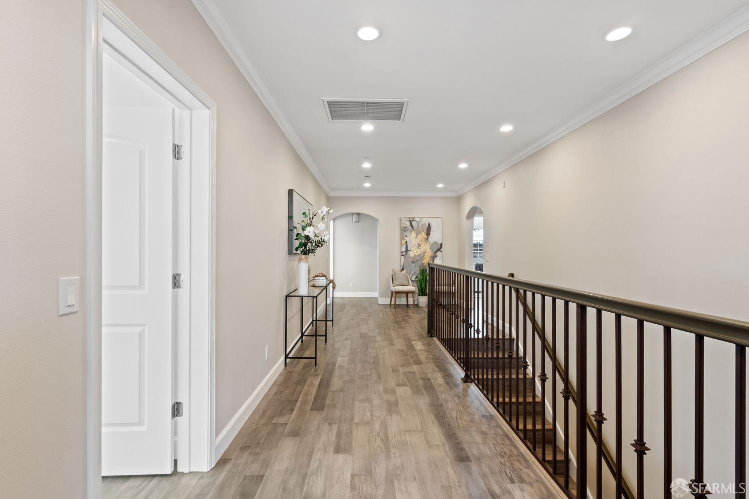 42119 Vinha Way Fremont, CA 94539 - Photo 24 of 43 a view of a hallway with wooden floor