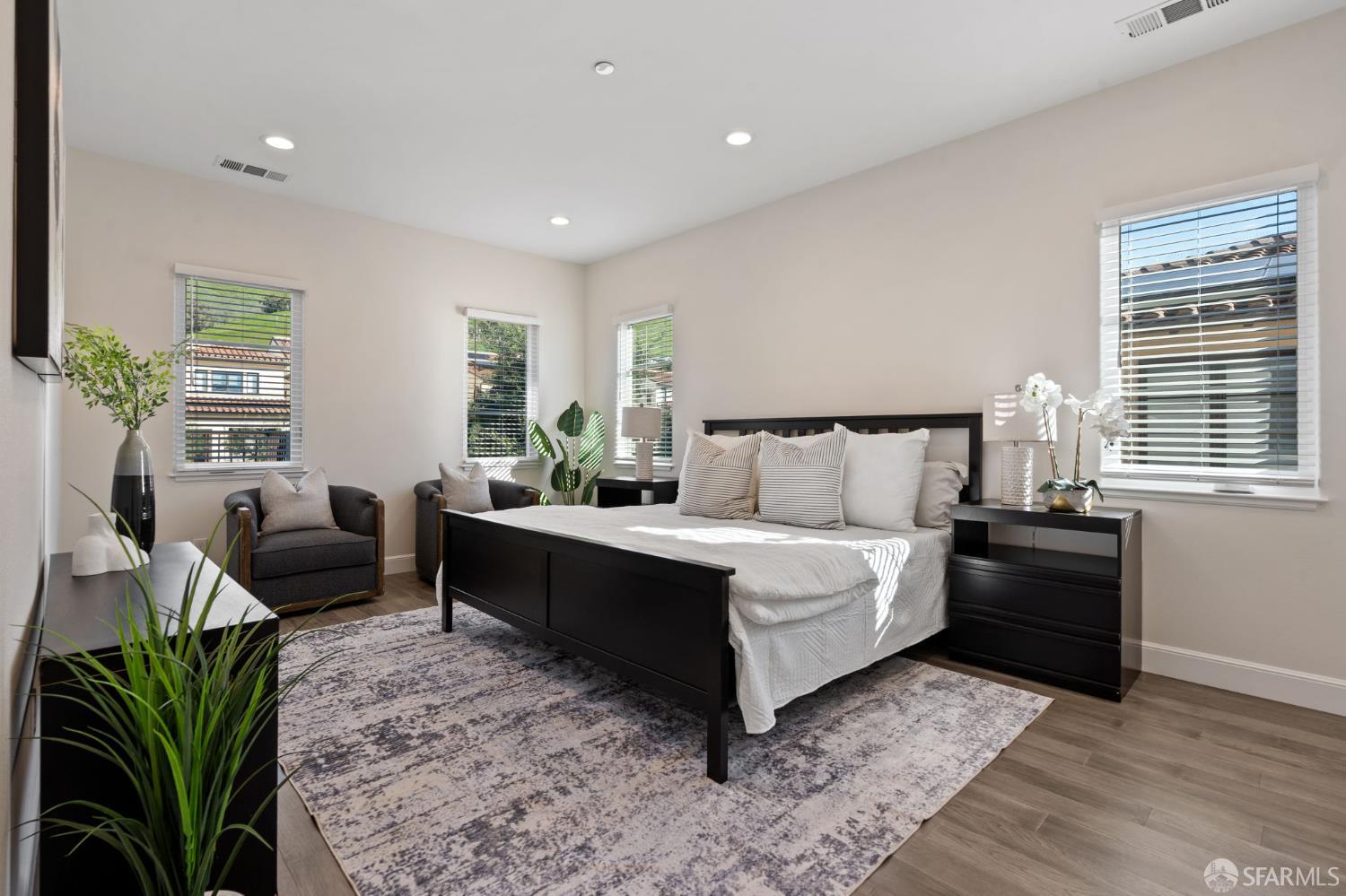 42119 Vinha Way Fremont, CA 94539 - Photo 27 of 43 a spacious bedroom with a bed and a couch