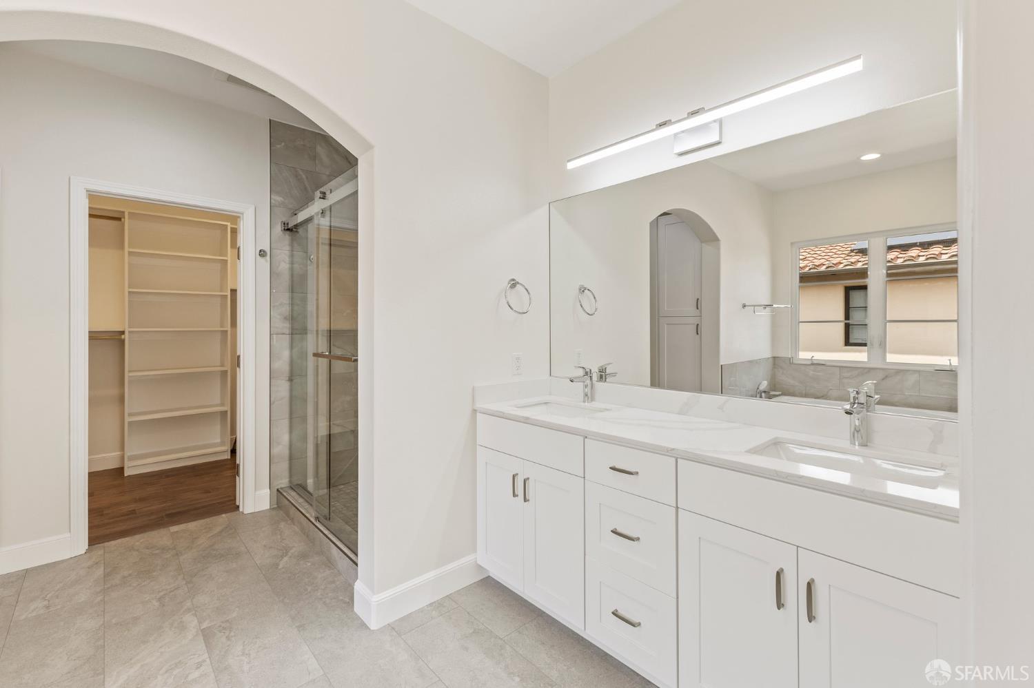 42119 Vinha Way Fremont, CA 94539 - Photo 28 of 43 a bathroom with a double vanity sink and mirror