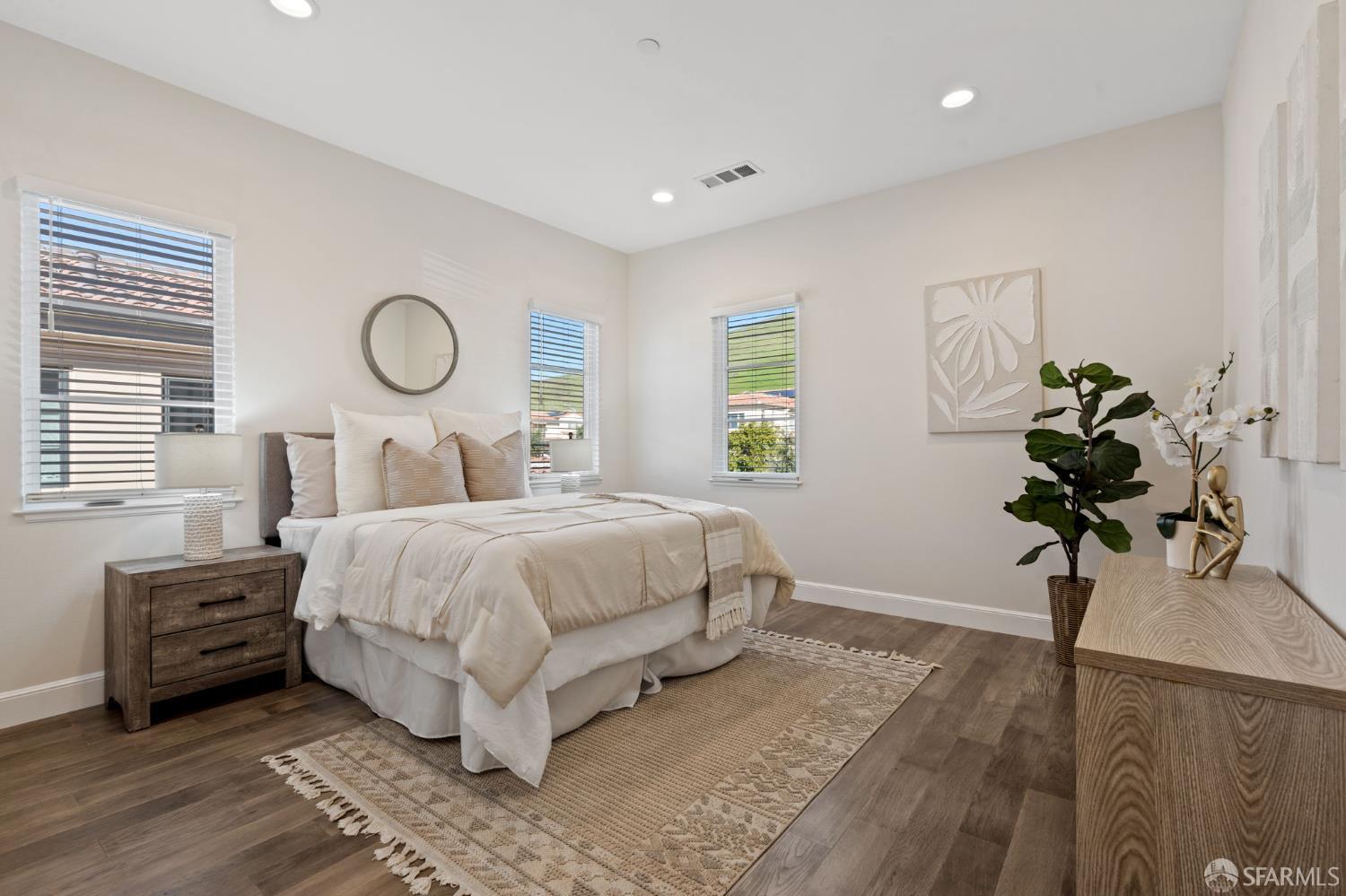 42119 Vinha Way Fremont, CA 94539 - Photo 31 of 43 a bedroom with a bed and a chandelier
