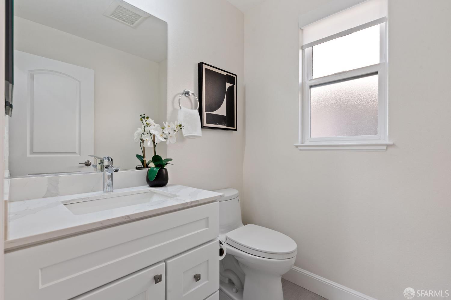 42119 Vinha Way Fremont, CA 94539 - Photo 37 of 43 a bathroom with a sink a toilet and mirror