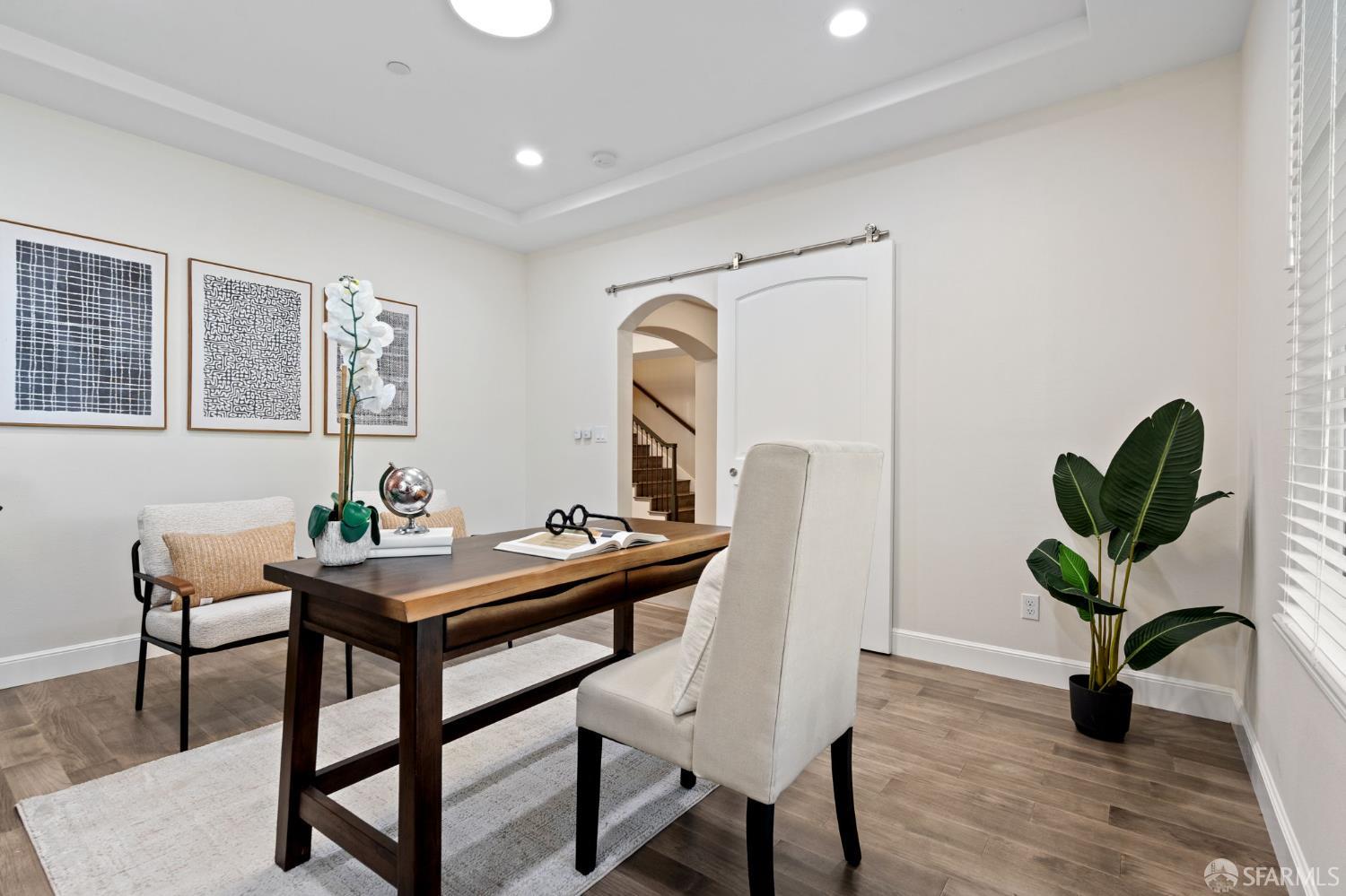 42119 Vinha Way Fremont, CA 94539 - Photo 5 of 43 a view of a workspace room with furniture and wooden floor