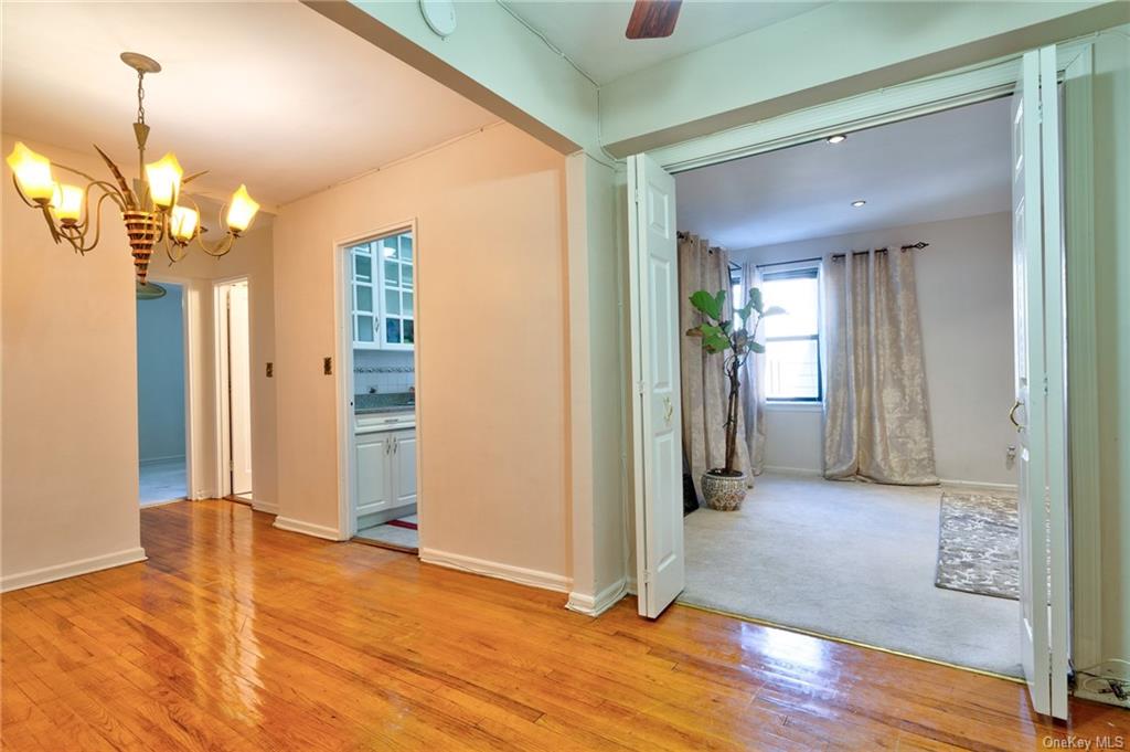a view of livingroom with hardwood floor and hallway