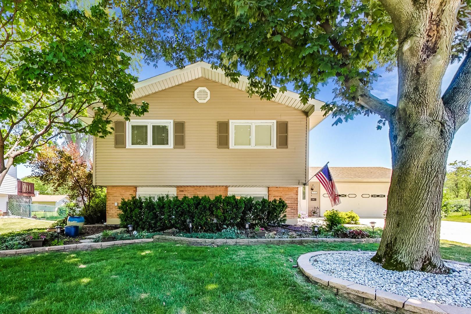 1715 Fremont Road Hoffman Estates, IL 60169 - Photo 1 of 59 a front view of a house with a yard