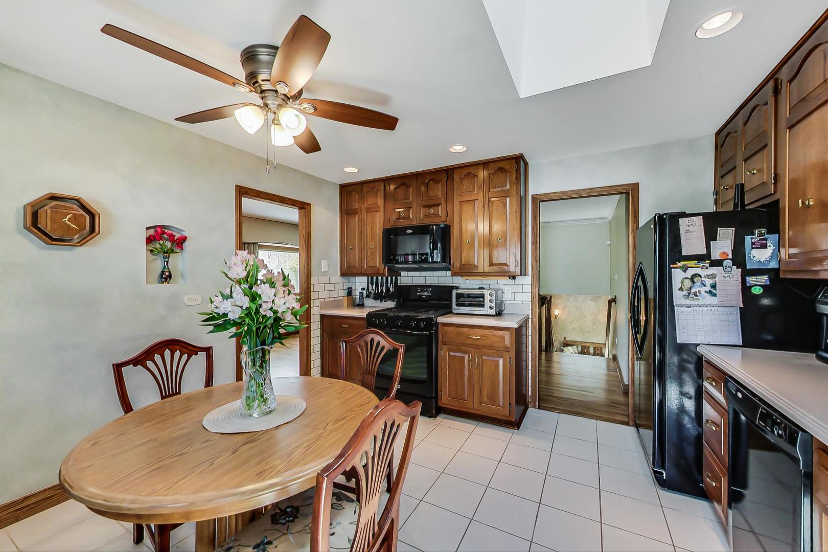1715 Fremont Road Hoffman Estates, IL 60169 - Photo 13 of 59 a kitchen with a table and chairs