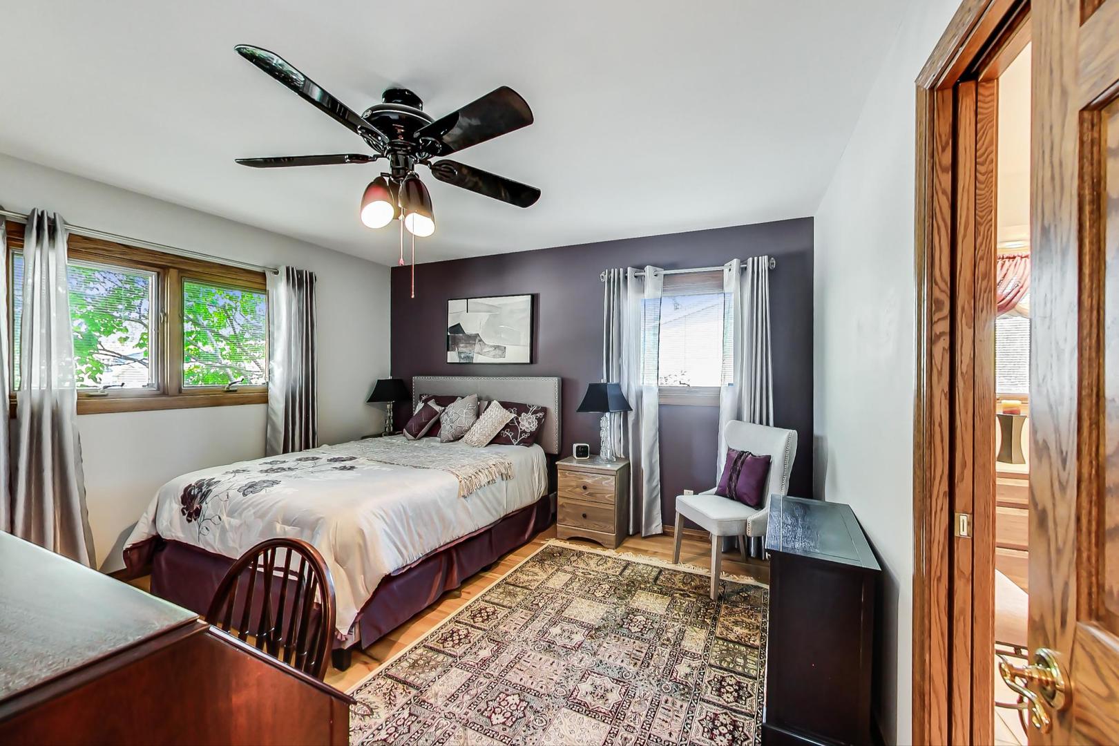 1715 Fremont Road Hoffman Estates, IL 60169 - Photo 15 of 59 a bedroom with a bed and wooden floor