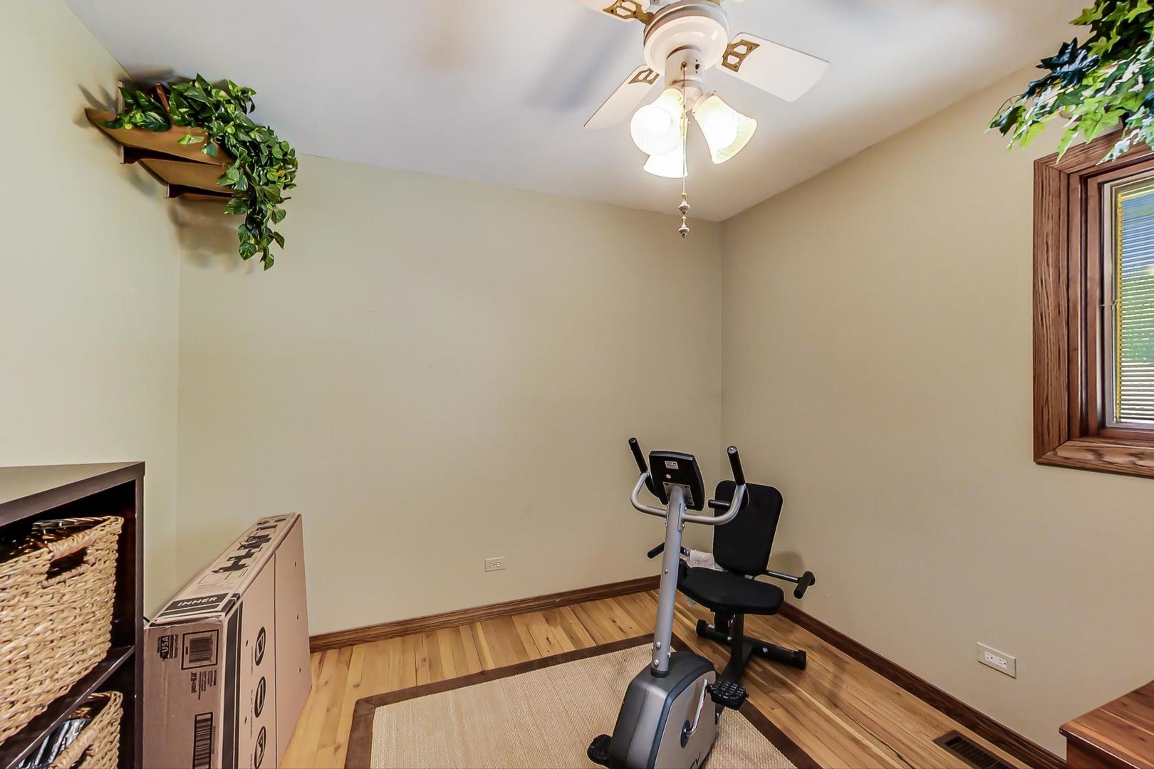 1715 Fremont Road Hoffman Estates, IL 60169 - Photo 25 of 59 a view of a workspace with furniture and a window