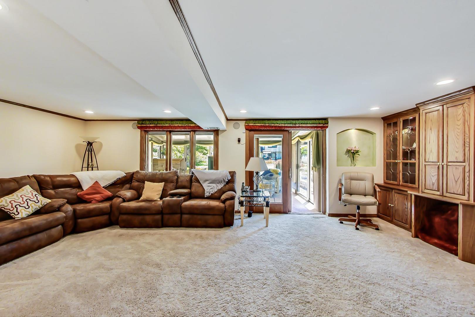 1715 Fremont Road Hoffman Estates, IL 60169 - Photo 27 of 59 a living room with furniture and a large window