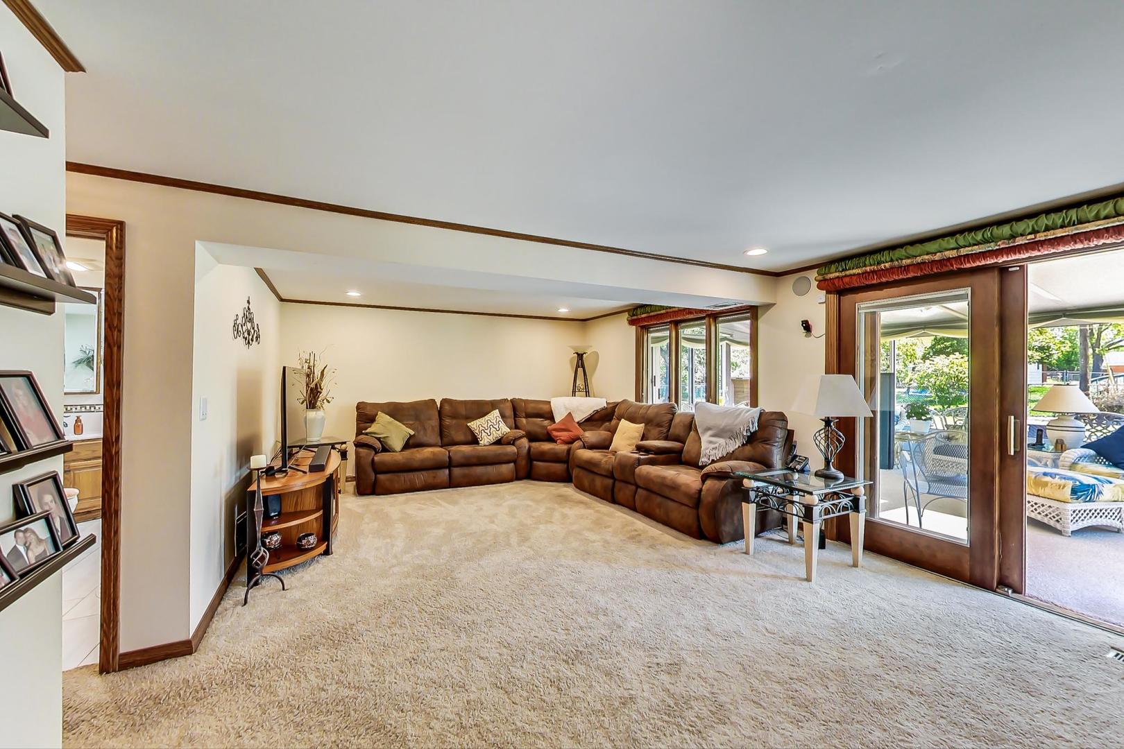 1715 Fremont Road Hoffman Estates, IL 60169 - Photo 28 of 59 a living room with furniture and a large window