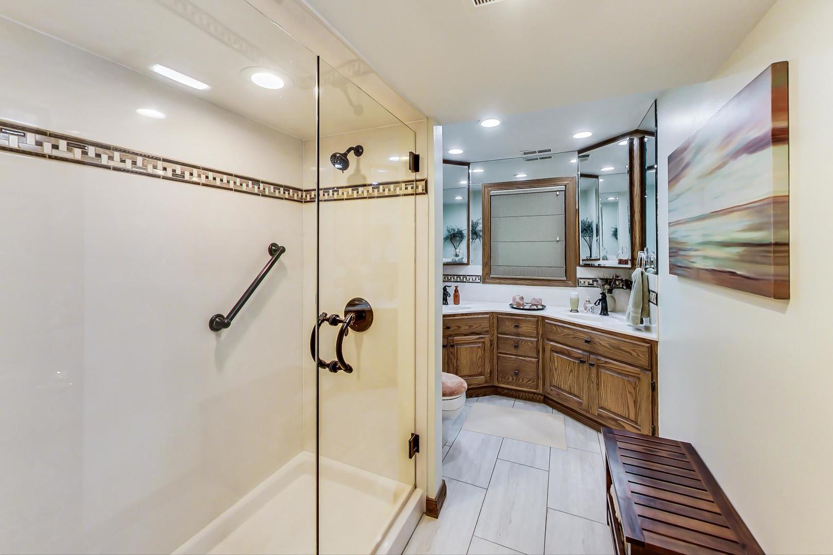 1715 Fremont Road Hoffman Estates, IL 60169 - Photo 36 of 59 a bathroom with a tub sink mirror and shower