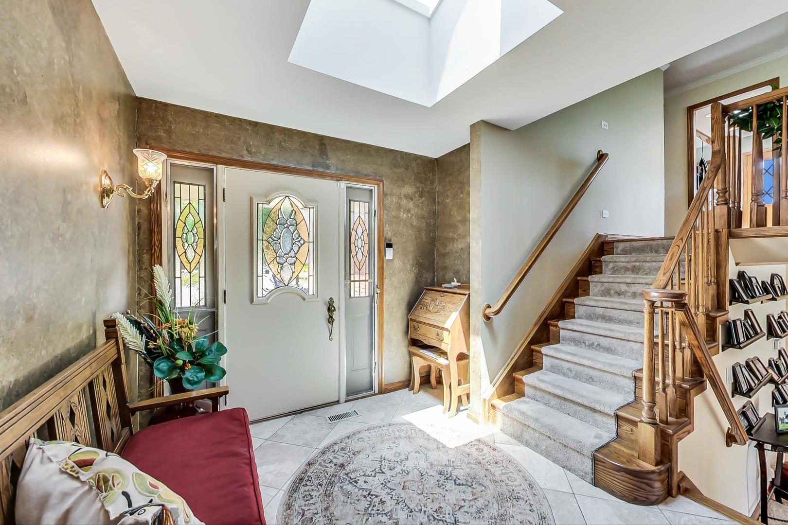 1715 Fremont Road Hoffman Estates, IL 60169 - Photo 4 of 59 a view of a livingroom with furniture and staircase