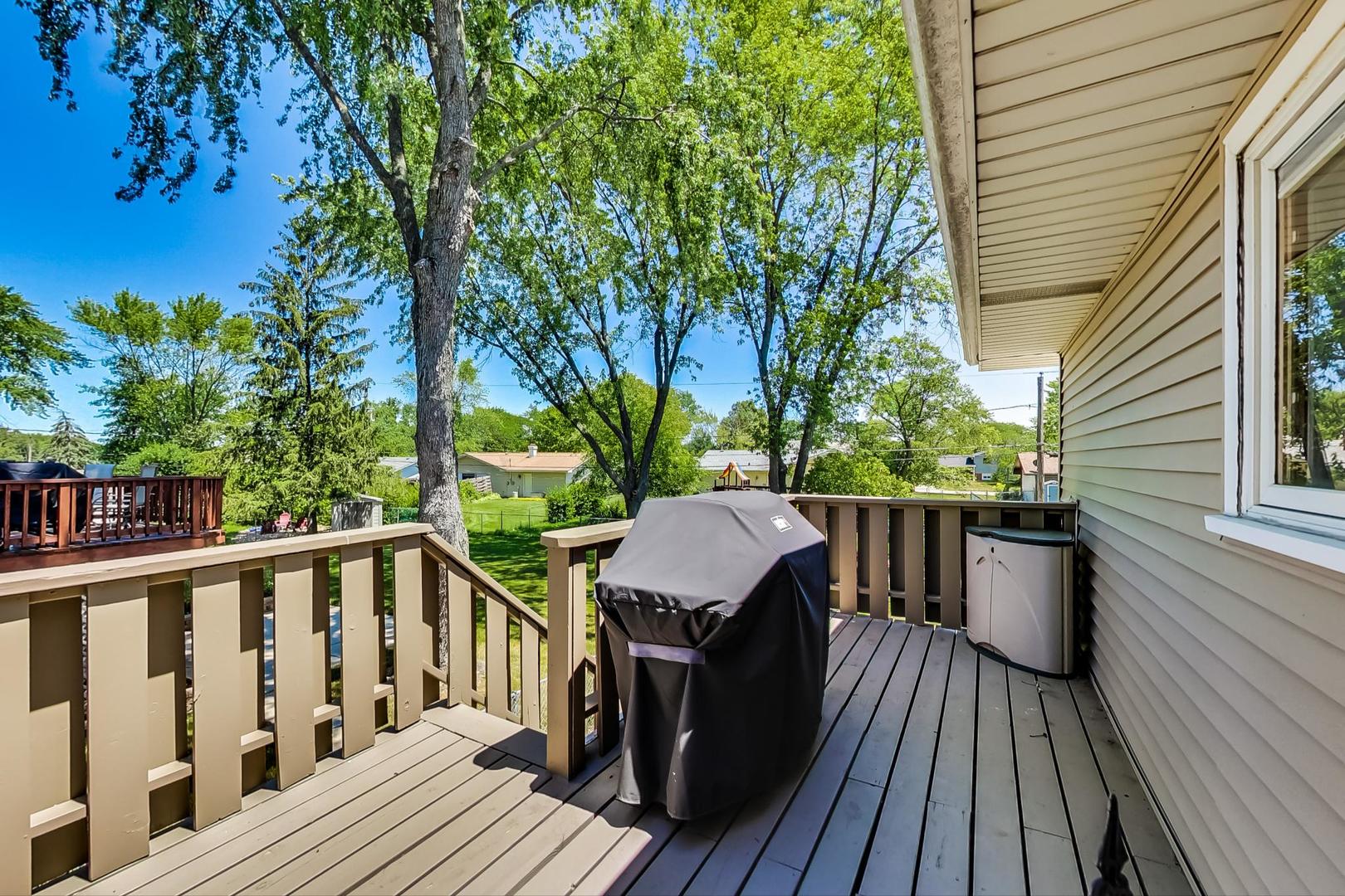 1715 Fremont Road Hoffman Estates, IL 60169 - Photo 43 of 59 a view of a wooden deck with a patio