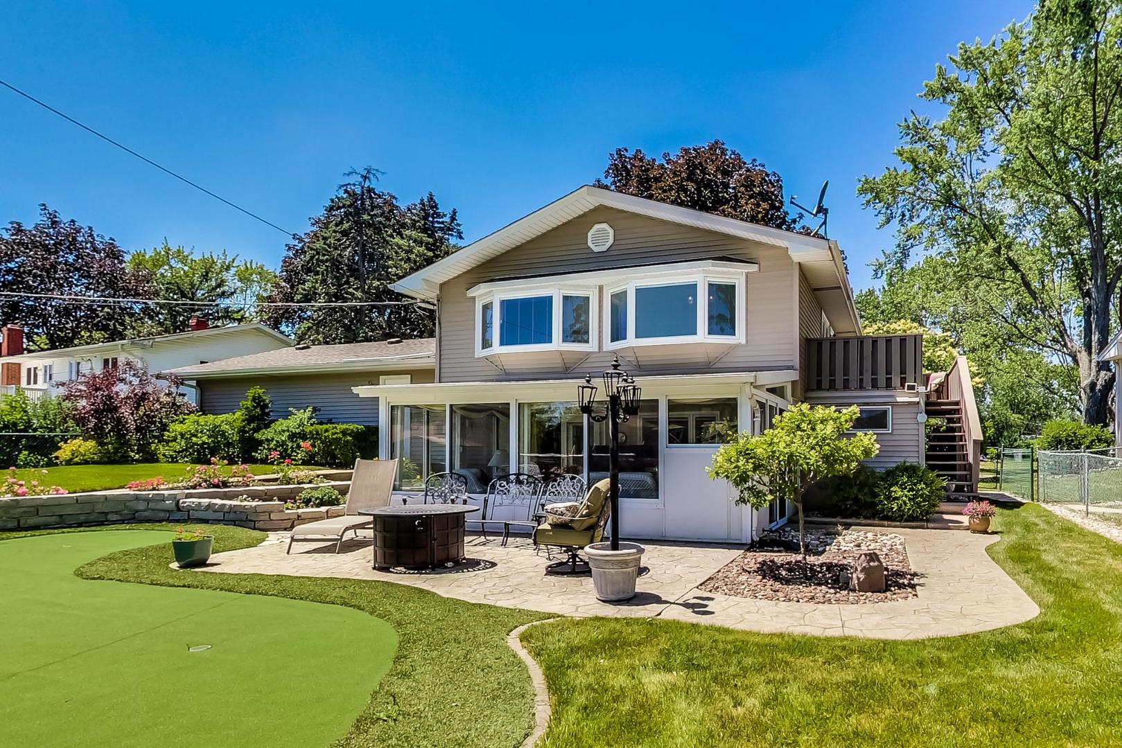 1715 Fremont Road Hoffman Estates, IL 60169 - Photo 45 of 59 a front view of a house with swimming pool yard and patio
