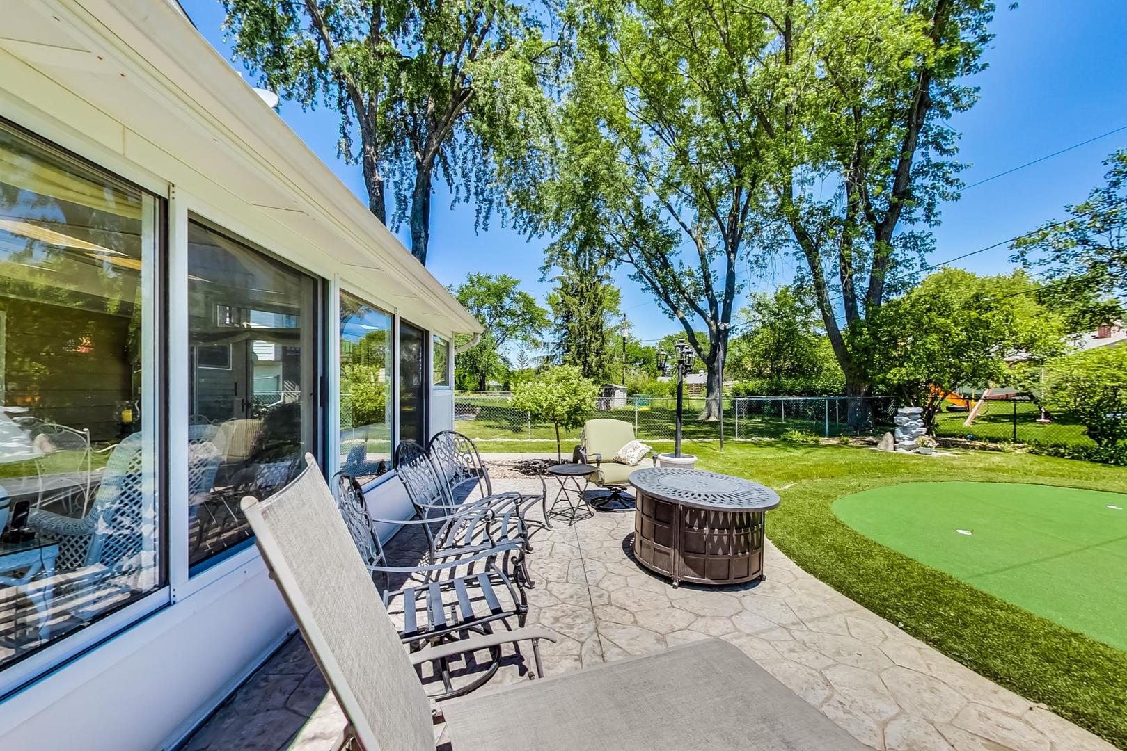 1715 Fremont Road Hoffman Estates, IL 60169 - Photo 49 of 59 a view of a chair and table in backyard of the house