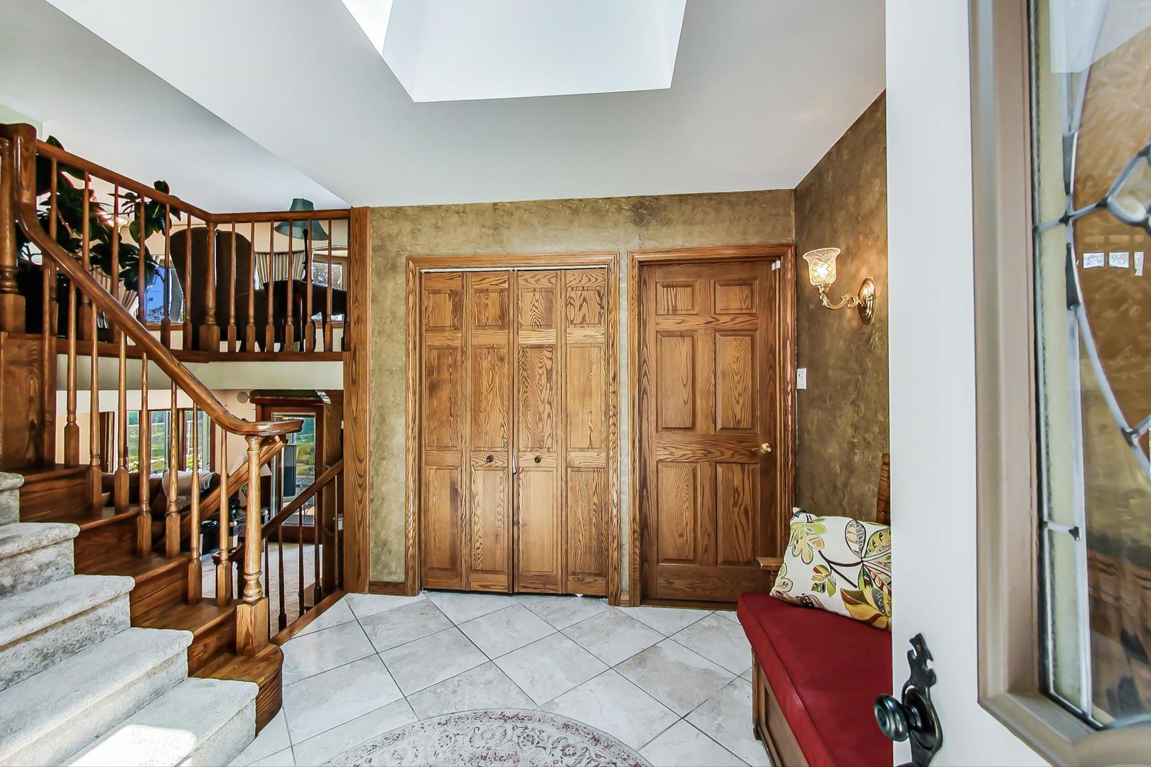 1715 Fremont Road Hoffman Estates, IL 60169 - Photo 5 of 59 a view of an entryway with wooden floor