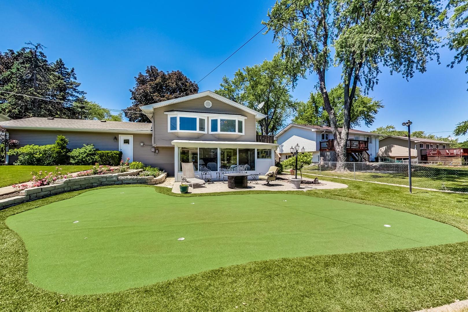 1715 Fremont Road Hoffman Estates, IL 60169 - Photo 54 of 59 a view of a house with swimming pool yard and sitting area