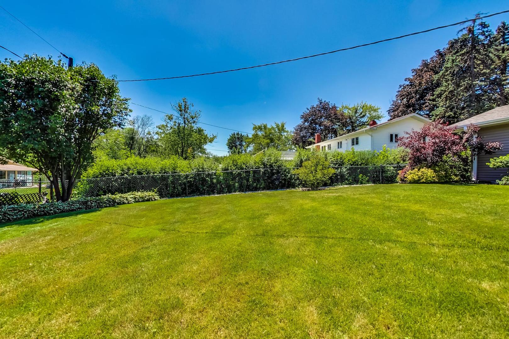 1715 Fremont Road Hoffman Estates, IL 60169 - Photo 57 of 59 a view of a yard with a house in the background