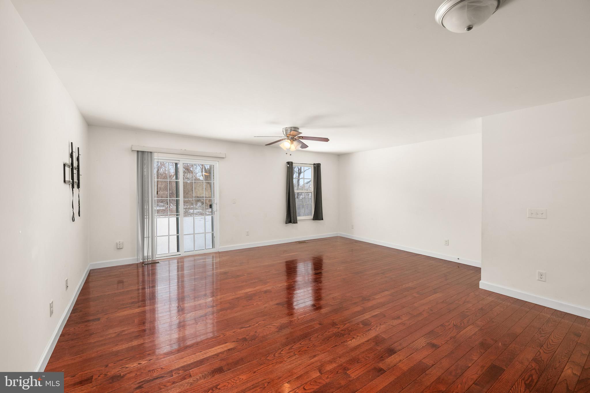 143 Medal Way Magnolia, DE 19962 - Photo 11 of 34 a view of an empty room with wooden floor and a window