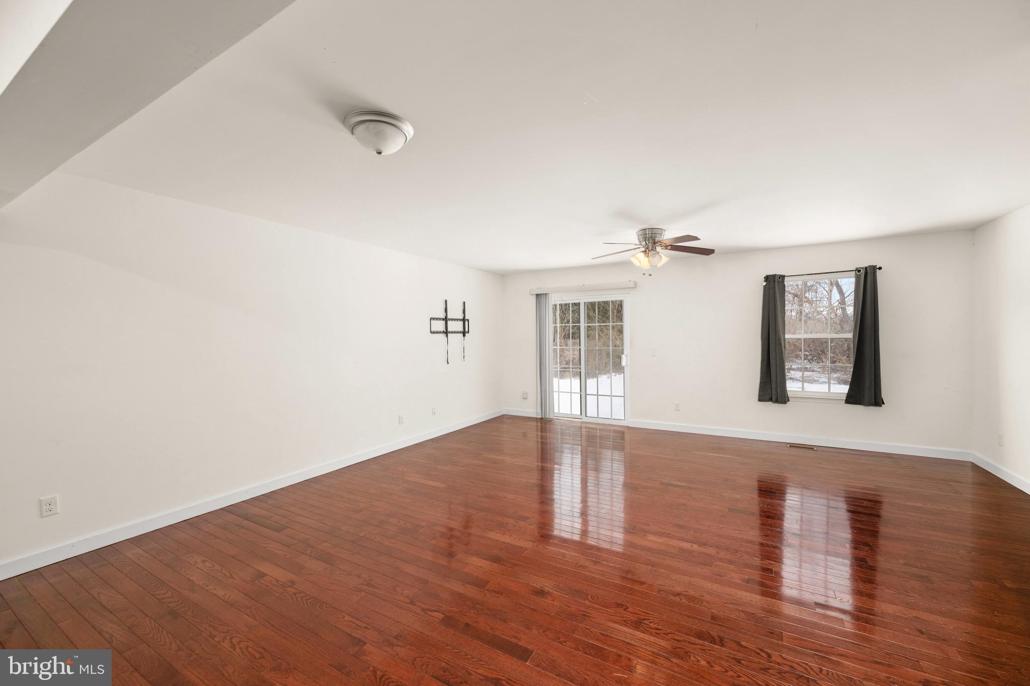 143 Medal Way Magnolia, DE 19962 - Photo 12 of 34 a view of empty room with wooden floor and fan