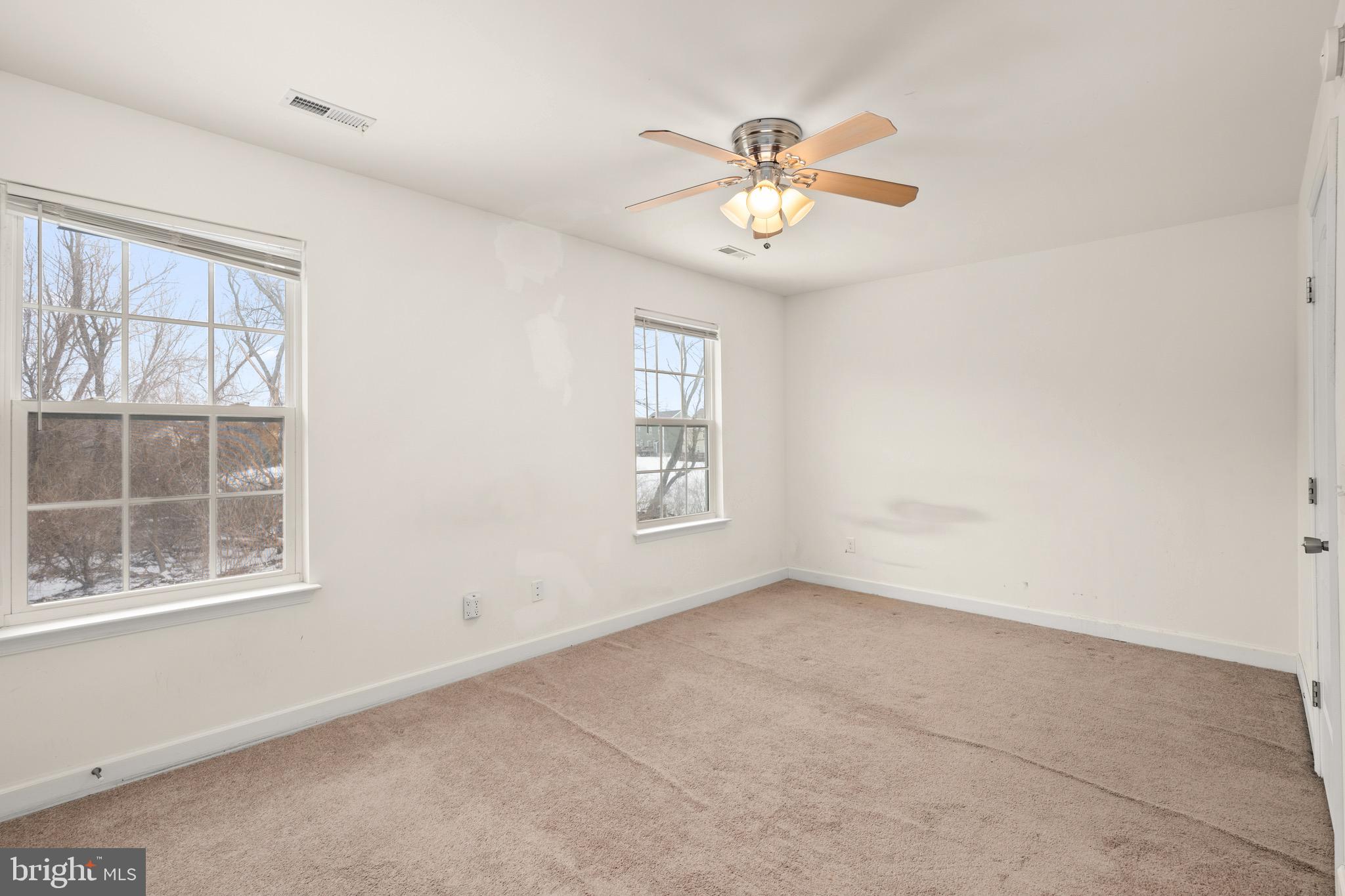 143 Medal Way Magnolia, DE 19962 - Photo 16 of 34 an empty room with windows and fan