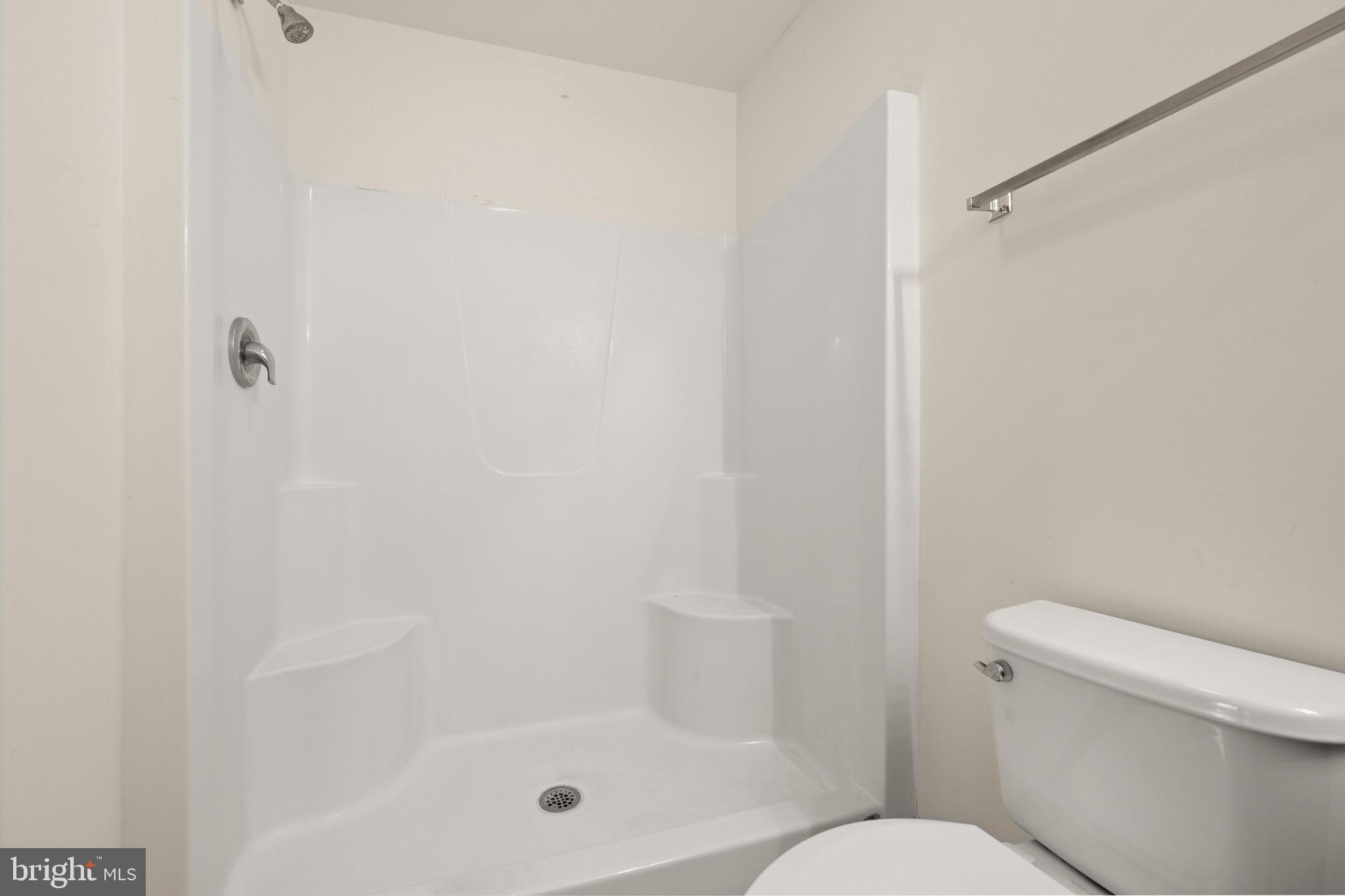 143 Medal Way Magnolia, DE 19962 - Photo 19 of 34 a bathroom with a shower and toilet