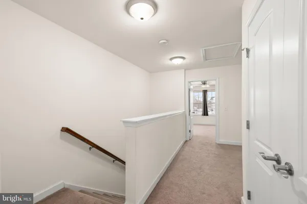 a view of a hallway with staircase