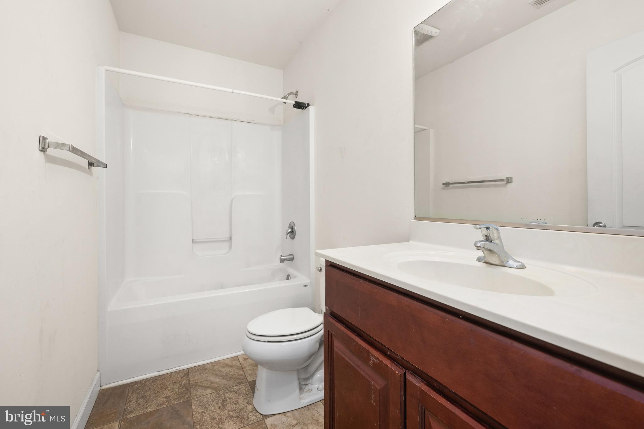 143 Medal Way Magnolia, DE 19962 - Photo 23 of 34 a bathroom with a sink a toilet and shower
