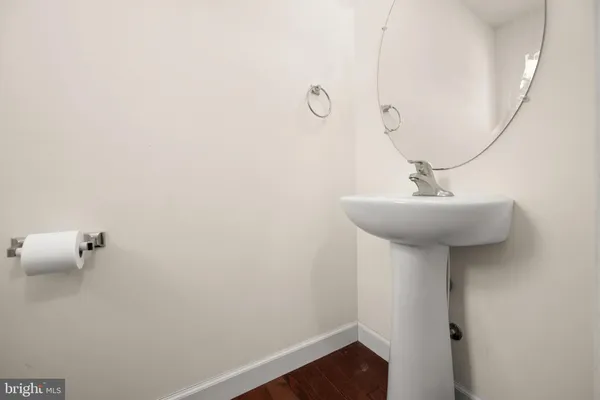 a bathroom with a sink and mirror