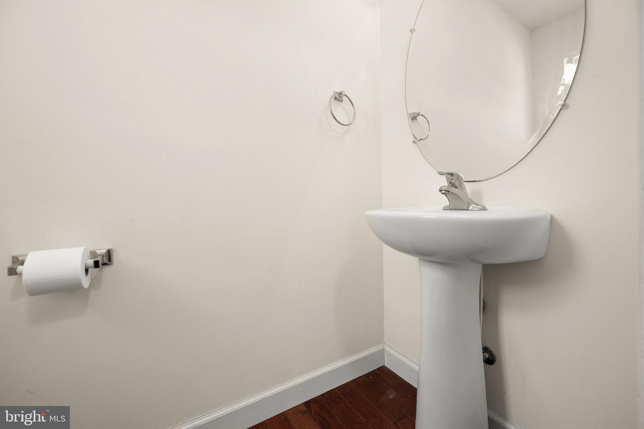 143 Medal Way Magnolia, DE 19962 - Photo 27 of 34 a bathroom with a sink and mirror