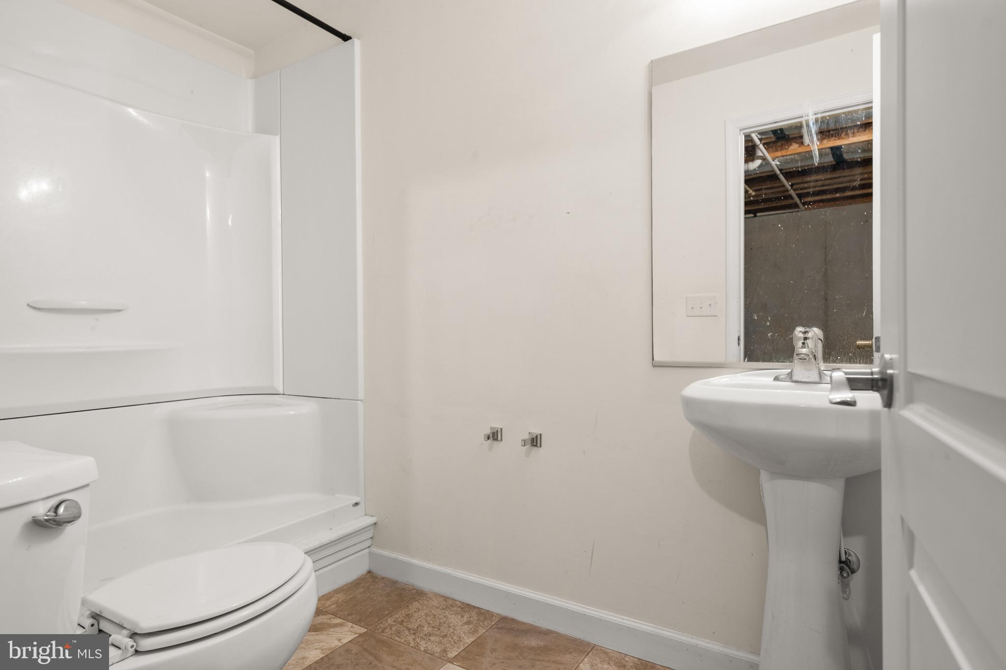 143 Medal Way Magnolia, DE 19962 - Photo 29 of 34 a bathroom with a sink a toilet and shower