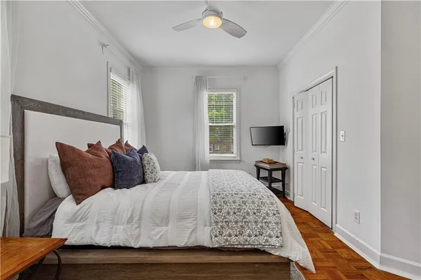 a bedroom with a bed and a tv