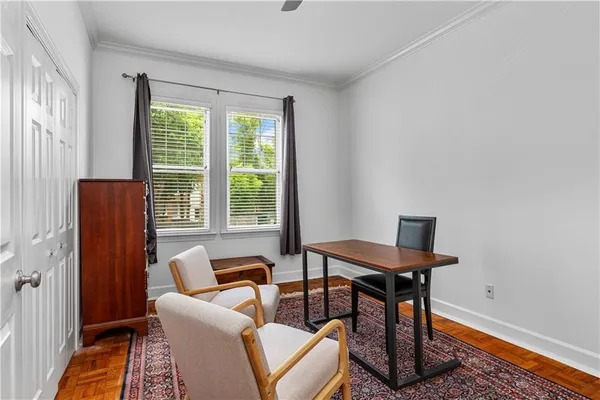 a view of a livingroom with furniture and a window