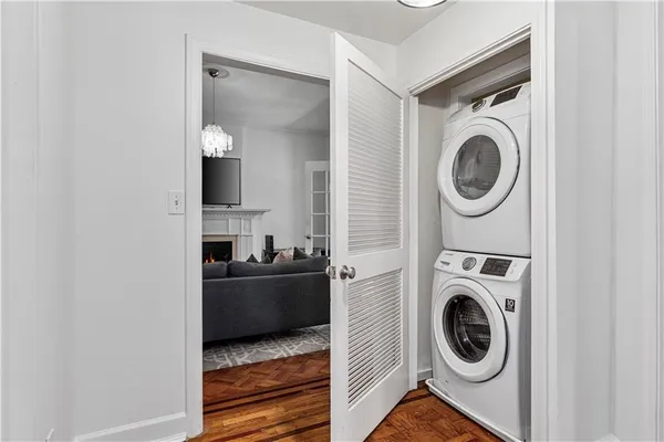 a view of a storage and utility room with washer and dryer