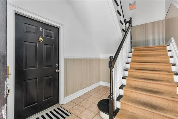 a view of entryway with wooden floor