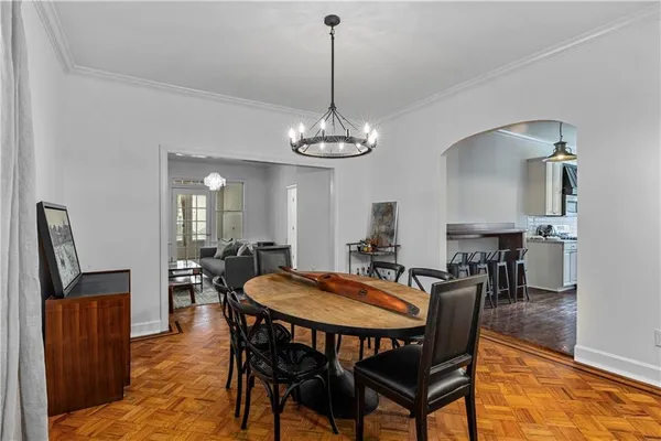 a view of a dining room with furniture and wooden floor